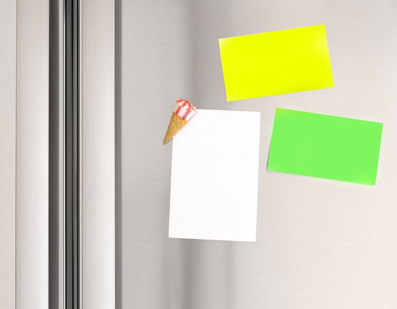 Colorful sticky notes on the fridge at home, abstract domestic background, paper for message, communication concept